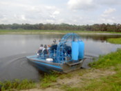 Another airboat, leaving the land...