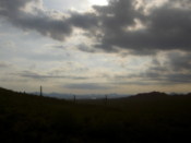 Darkness falls on the hills as the sun hides away