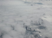 Mountains poke through the clouds