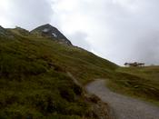 The path with a ski lift station in the distance