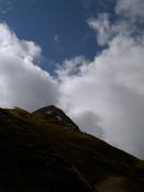 The sky reflects the shape of the peak