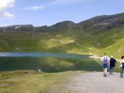 Surrounding hills reflect in the lake